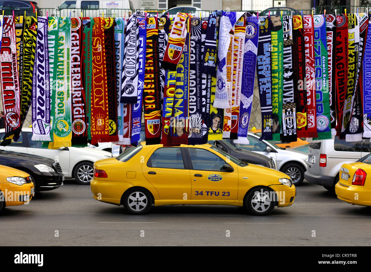 Colourful scarfs as merchandise of Turkish and European football clubs hanging for sale by the roadside in Istanbul, Turkey Stock Photo