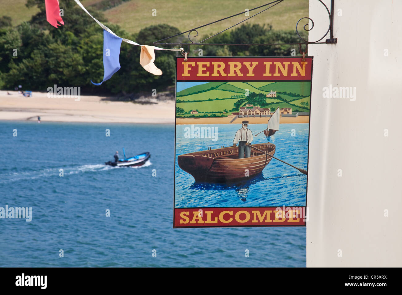 The Ferry Boat inn with the ferry or water taxi  in the background.Salcombe, Devon, England, United Kingdom. Stock Photo