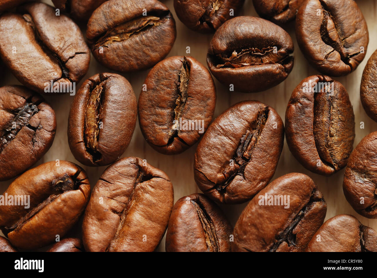 Close-up of a coffee beans on the wooden table, top view Stock Photo