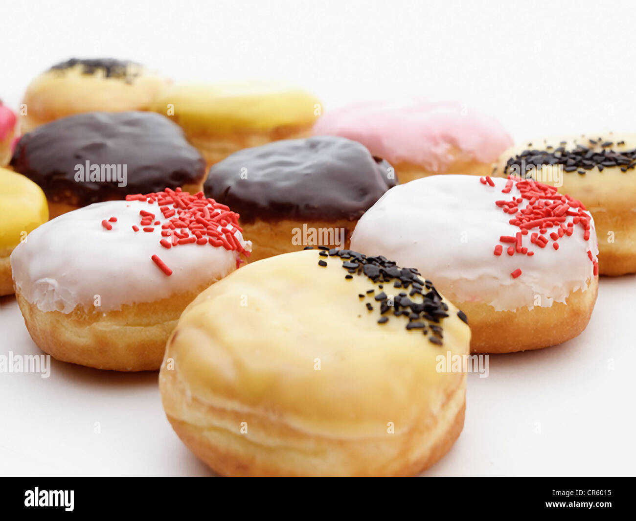 A lot of donuts on a white background. Stock Photo