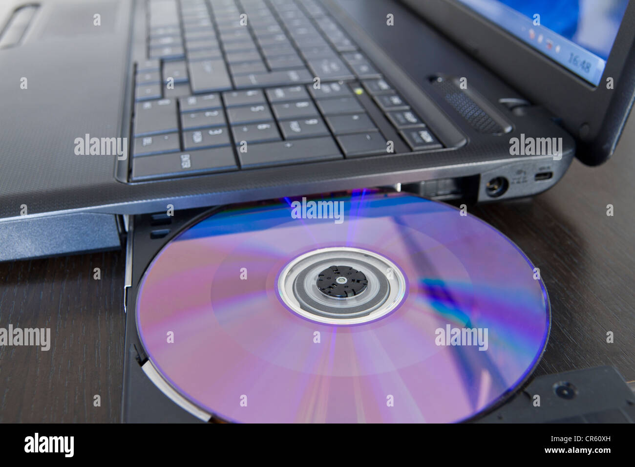 Loading software into a laptop Stock Photo