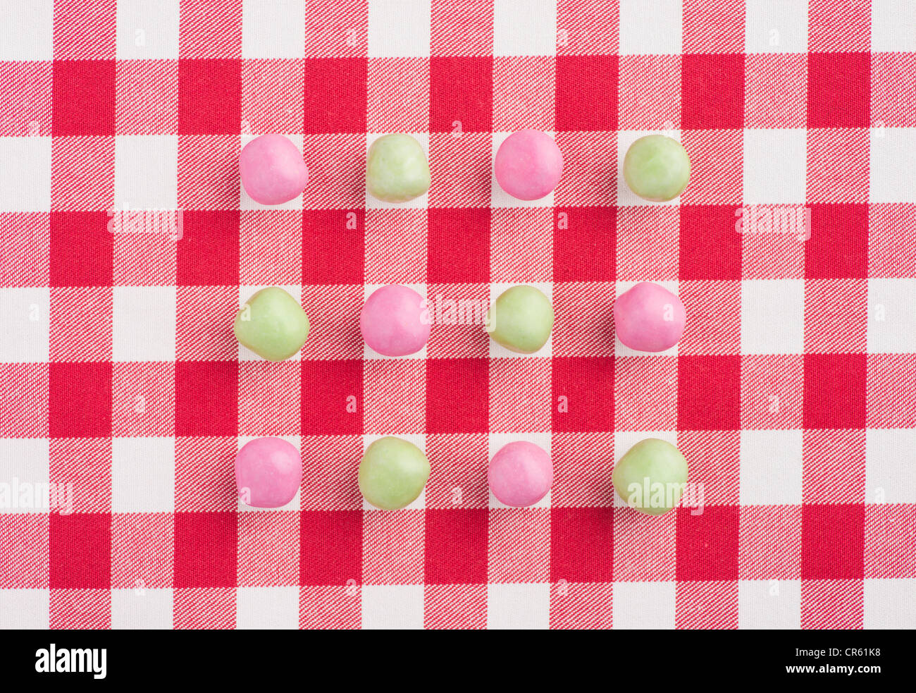Candy on a red and white chequered tablecloth Stock Photo