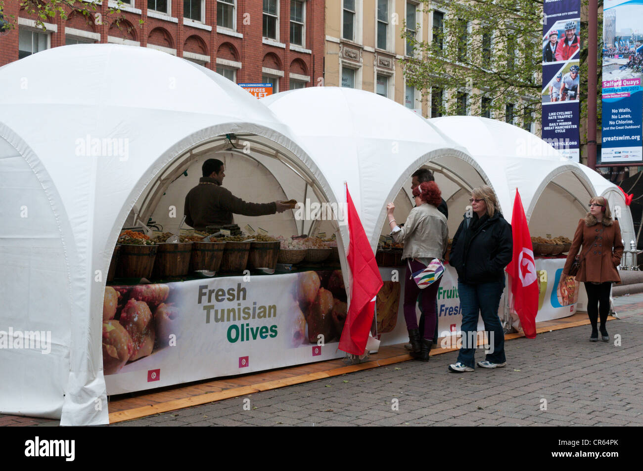 A market in St Anne's Square, Manchester selling Tunisian Olives. Stock Photo