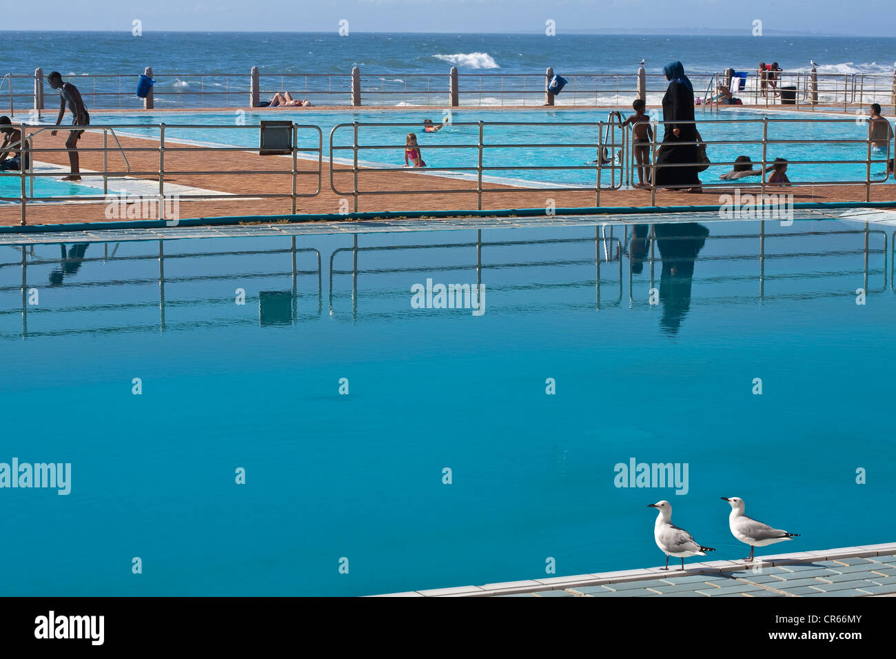 South Africa, Western Cape, Cape Town, Sea Point, outdoor swimming pool on the seaside Stock Photo