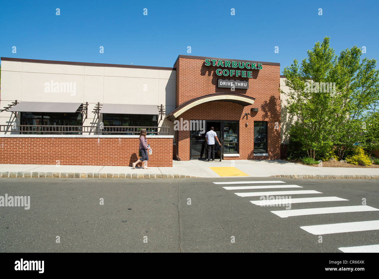 People walking into Starbucks Coffee shop Stock Photo Alamy