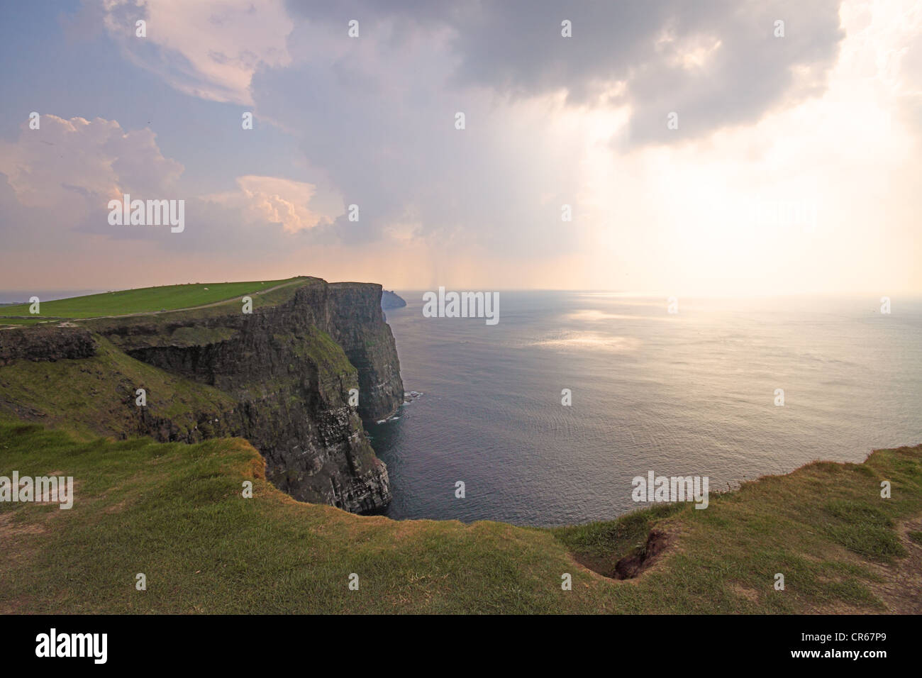 The Cliffs of Moher (Ireland) in a misty day at dusk Stock Photo