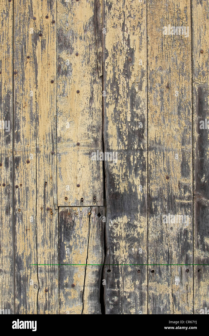 Wooden wall with peeling paint Stock Photo