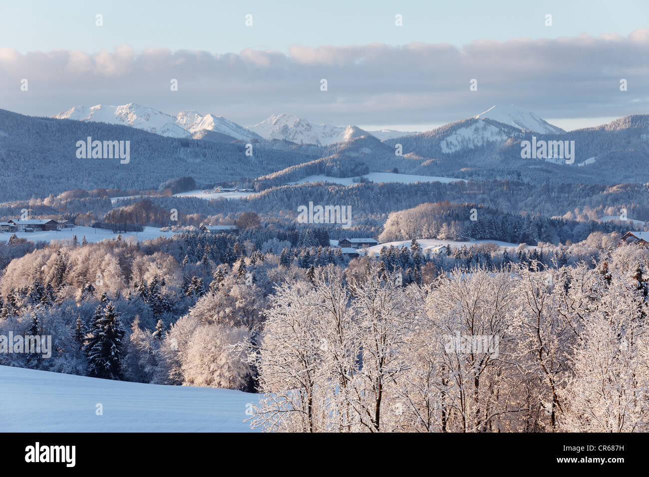 Germany, Bavaria, View of alpine foothills with Mangfallgebirge mountains in background Stock Photo