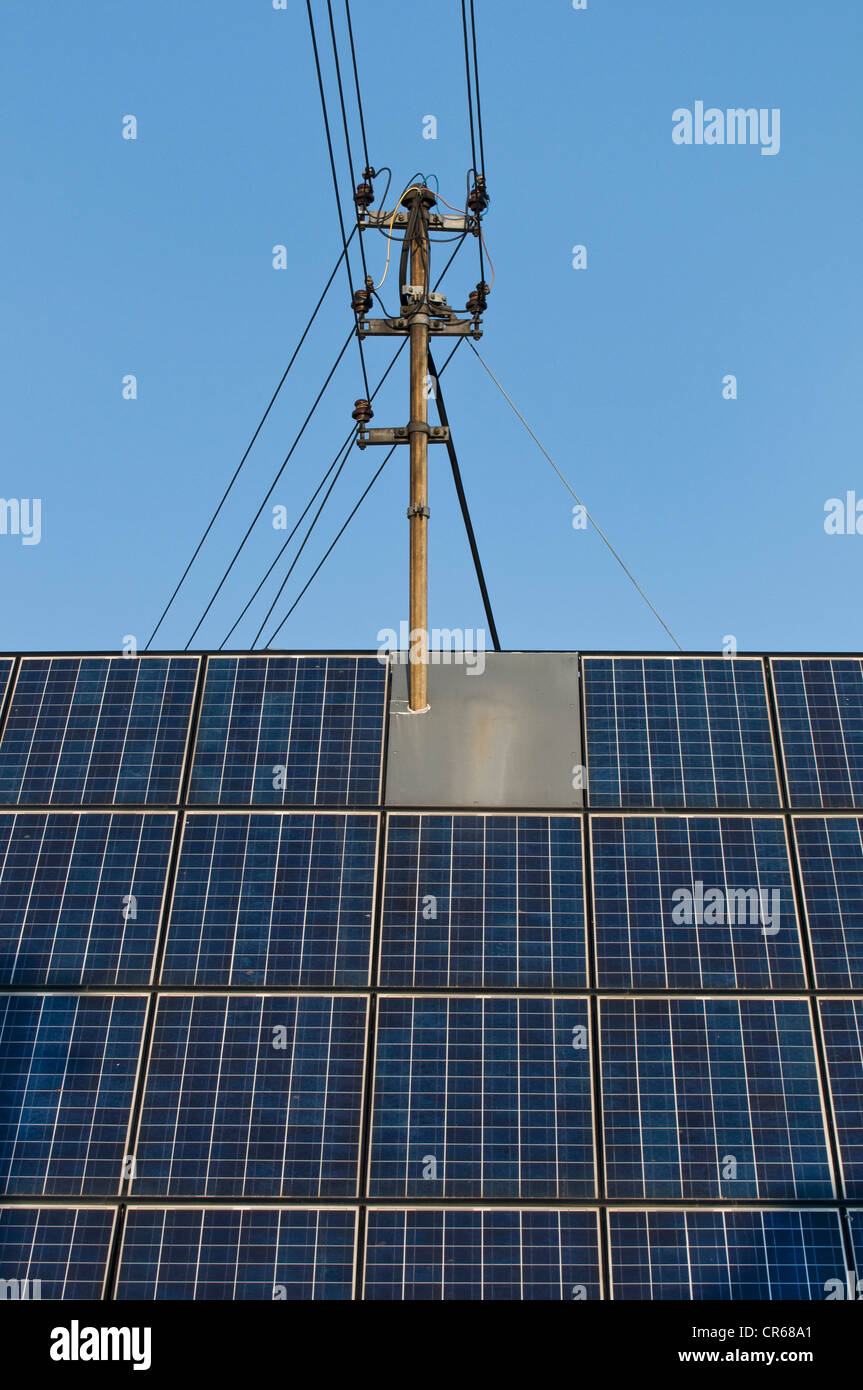 Roof with solar panels and a power pole, consumers produce their own