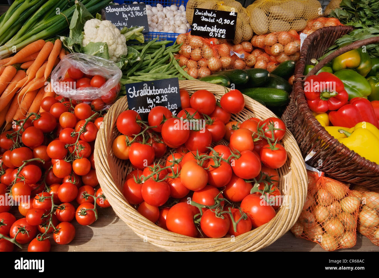 Sales display, colorful vegetables, tomatoes, peppers, onions, beans