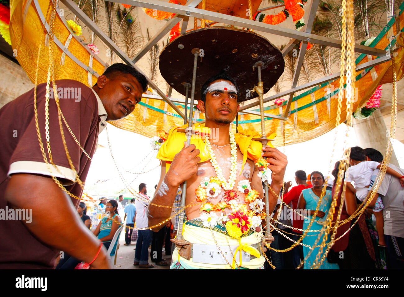 Pilgrim is prepared for his walk with spiritual piercings, Hindu festival Thaipusam, Batu Caves limestone caves and temples Stock Photo