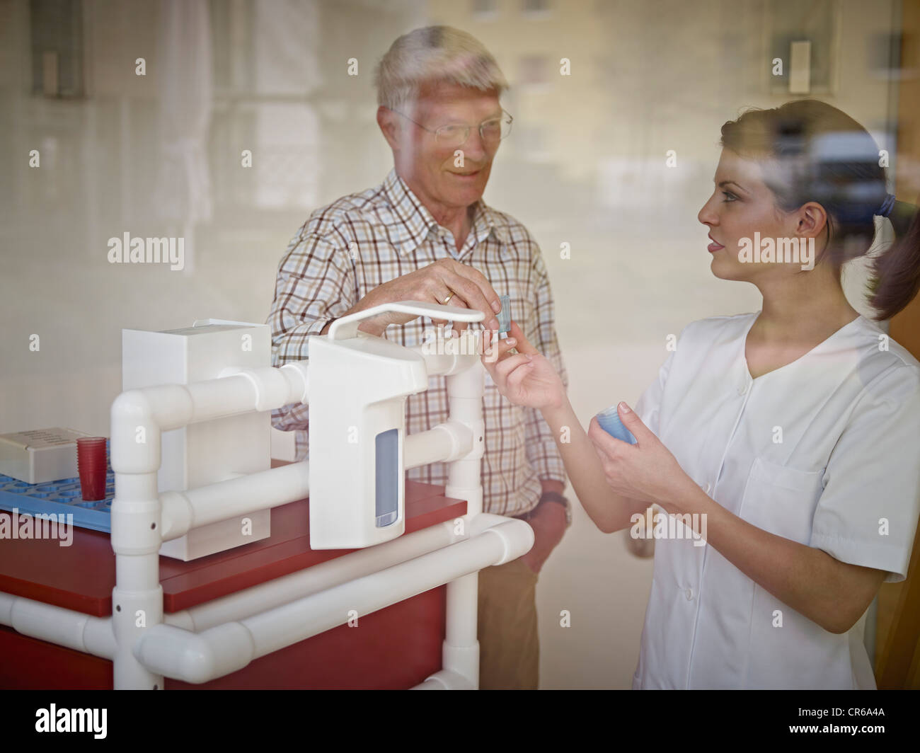 Germany cologne caretaker giving medicine hires stock photography and