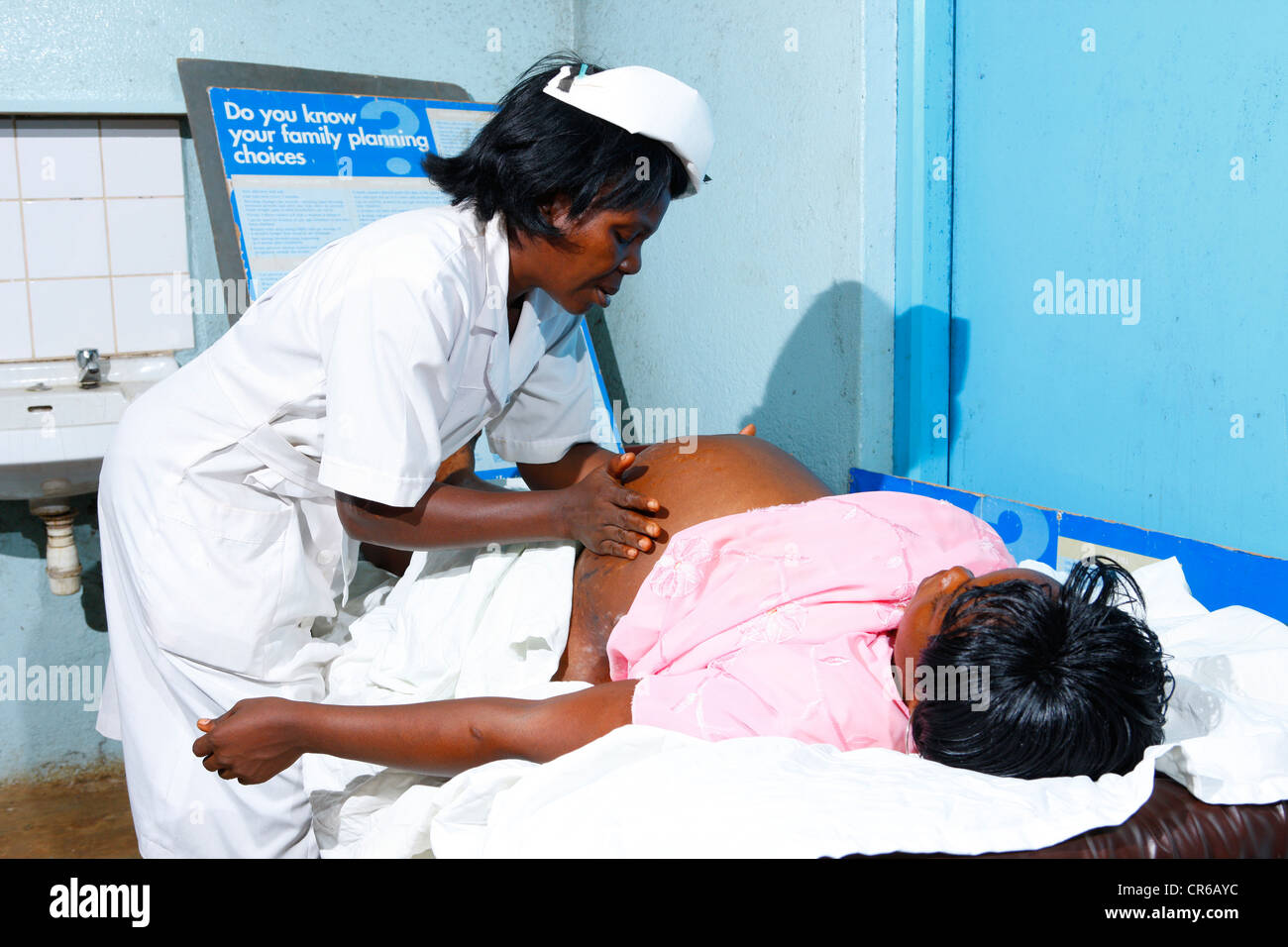Midwife and pregnant woman, consultation and screening, hospital, Manyemen, Cameroon, Africa Stock Photo