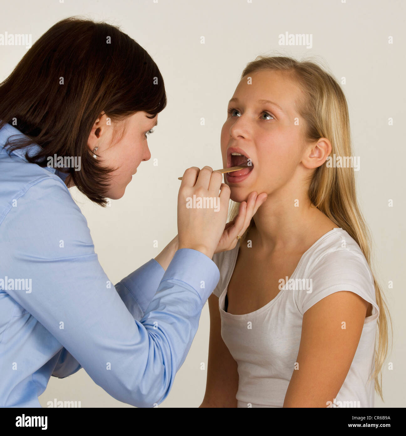 Doctor Examining Teen Girl Doctor Examining Teen Girl
