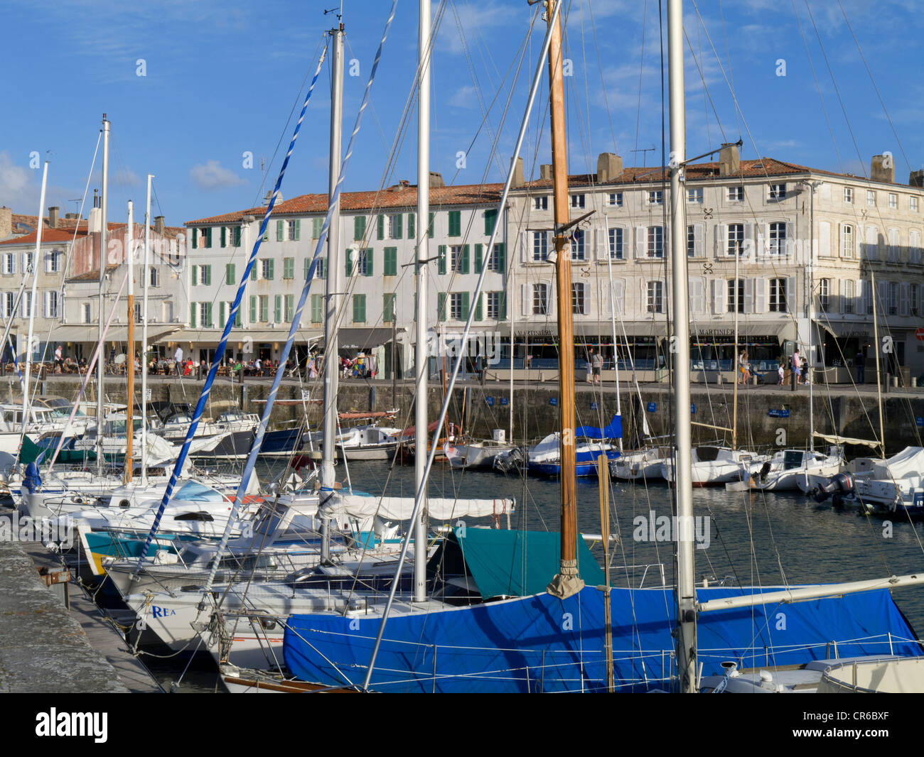 France, Ile de Re, St Martin de Re, harbour towards town and restaurants with boats in foreground Stock Photo