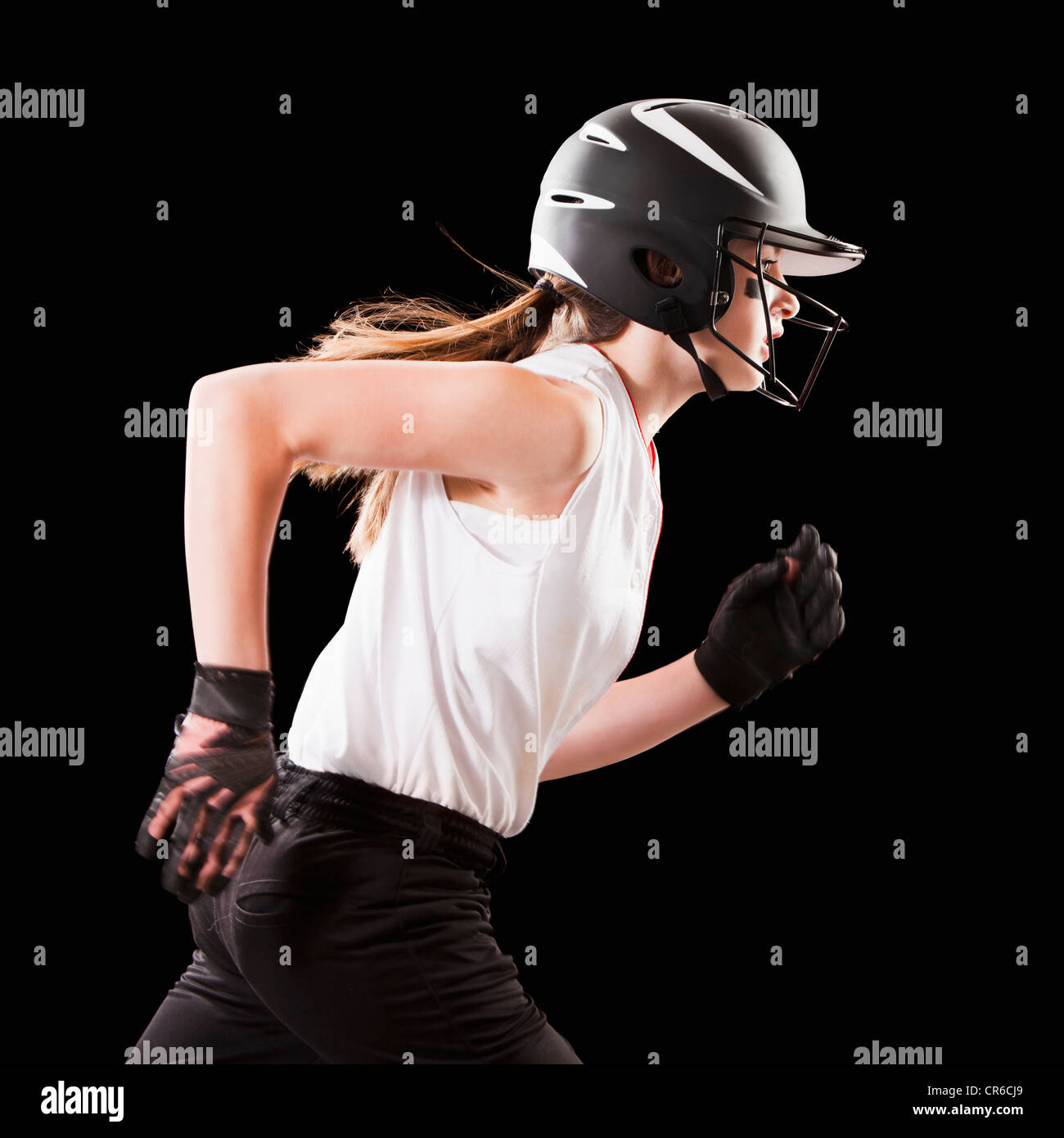 Portrait of girl (12-13) plying softball Stock Photo