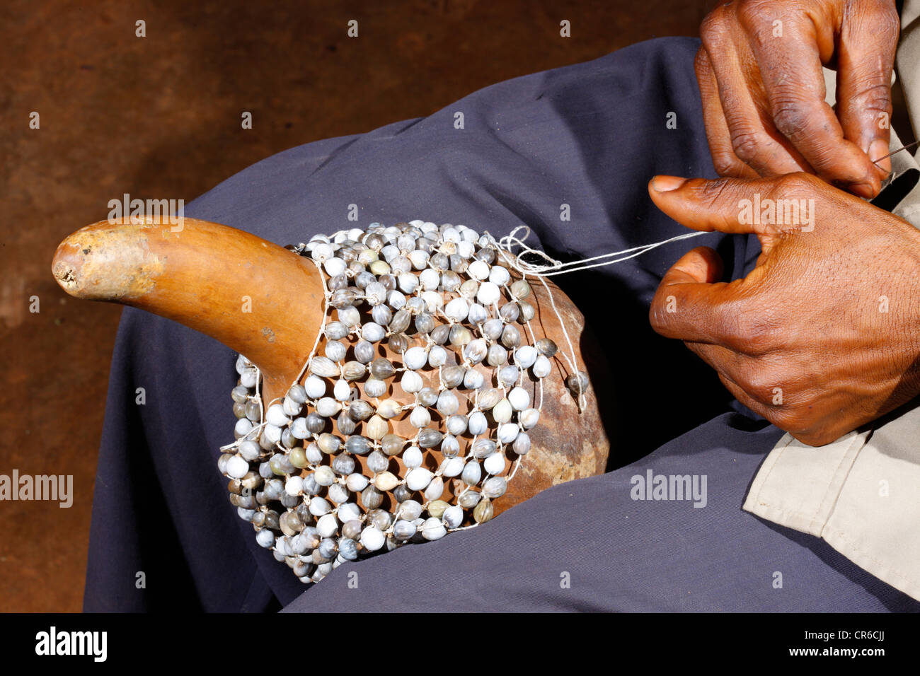 Man producing a traditional hand rattle, Juju Rattles from Klebassen, Bafut, Cameroon, Africa Stock Photo