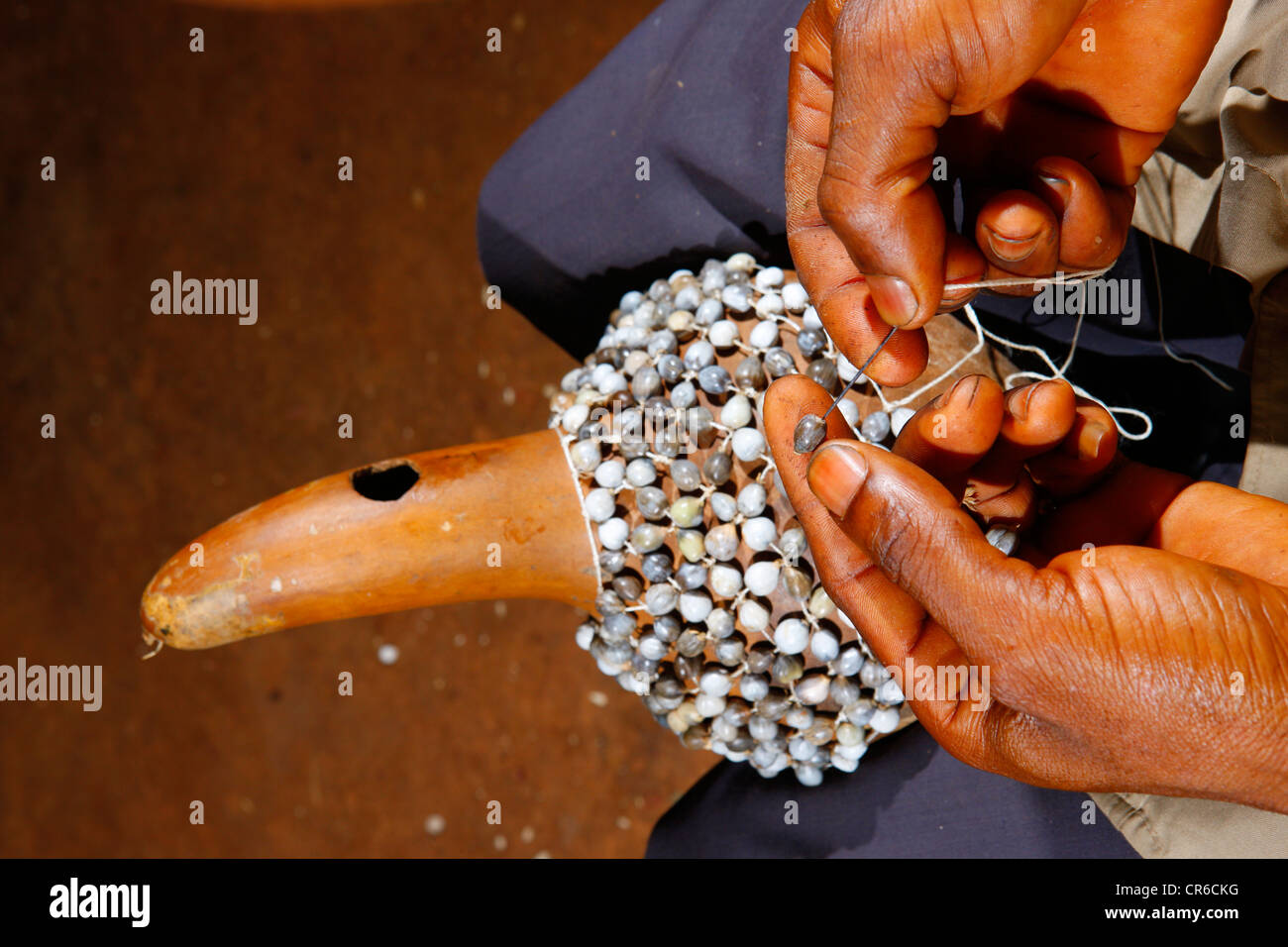 Man producing a traditional hand rattle, Juju Rattles from Klebassen, Bafut, Cameroon, Africa Stock Photo