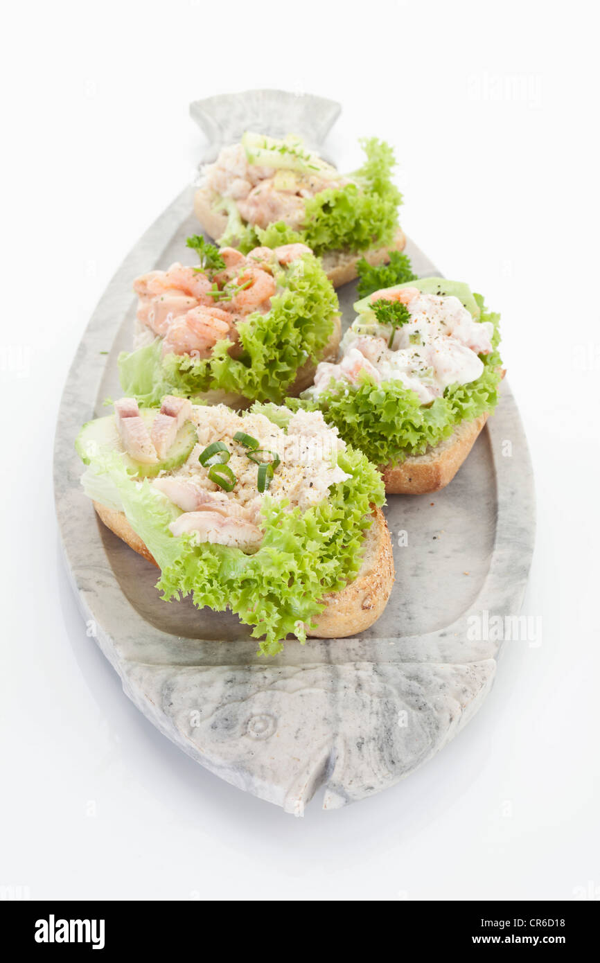 Shrimp and trout fillet tartar sandwiches in plate on white background Stock Photo