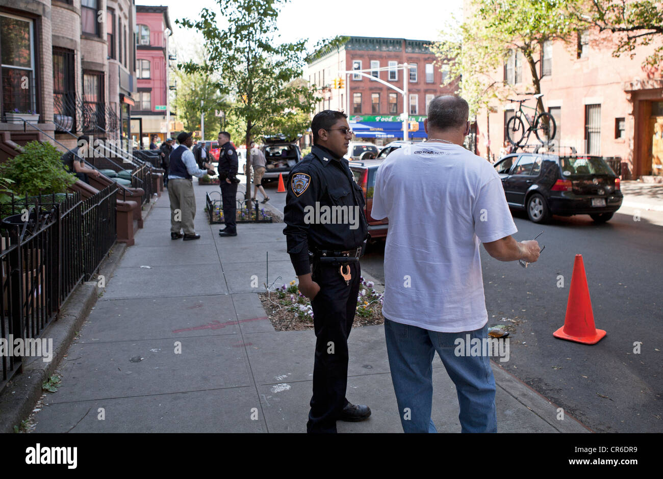 Police in New York City investigate an altercation involving 2 men. Stock Photo