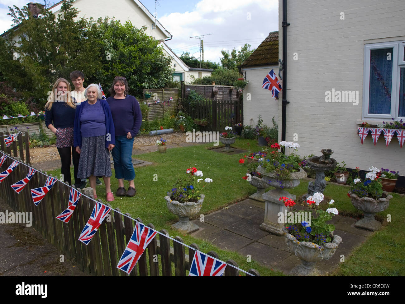 Garden decorated Union Jack flags Royal diamond jubilee family posing June 2012 Stock Photo