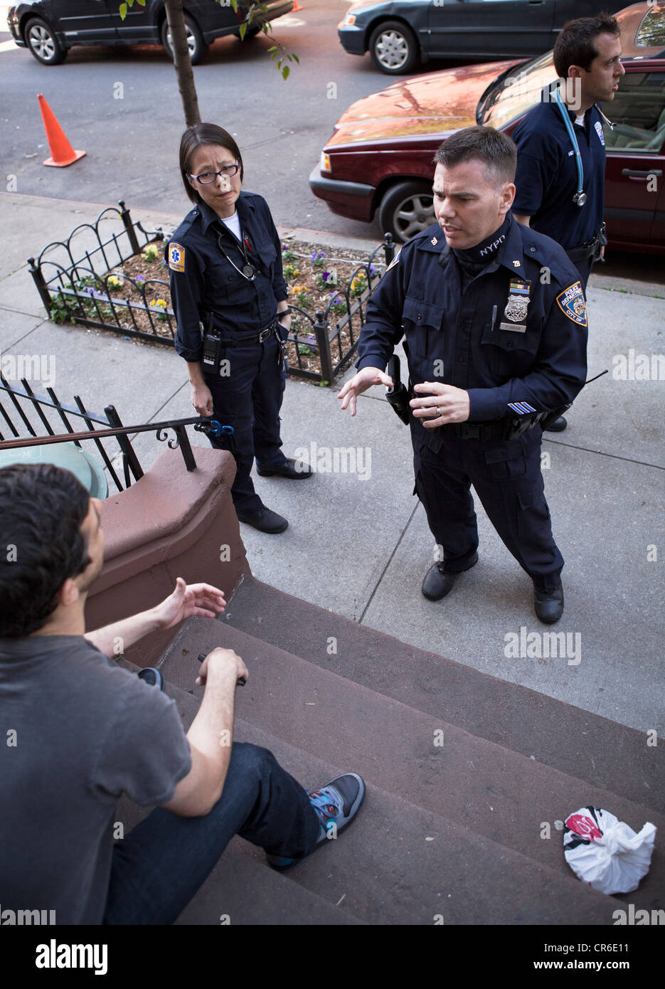Police in New York City investigate an altercation involving 2 men. Stock Photo