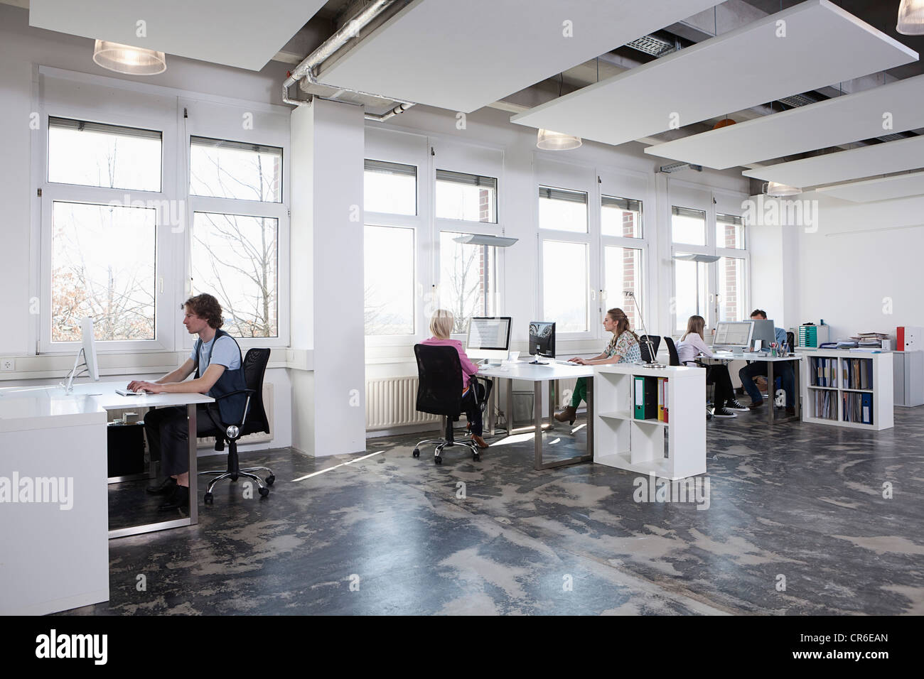 Germany, Bavaria, Munich, Men and women working on computer in office Stock Photo Alamy