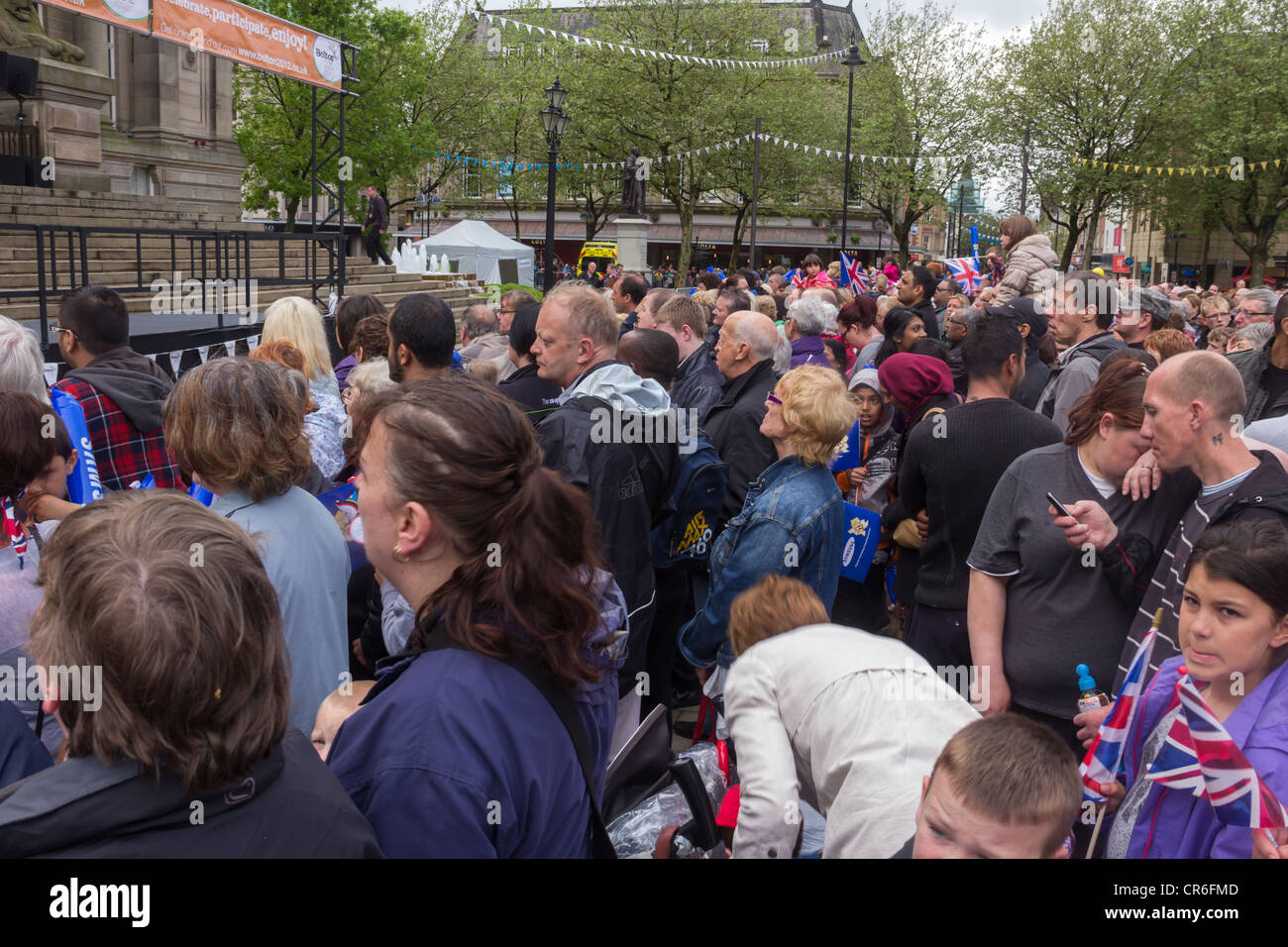 Crowds gathered in Victoria Square, Bolton to witness the arrival of the Olympic torch on its journey round the UK. Stock Photo