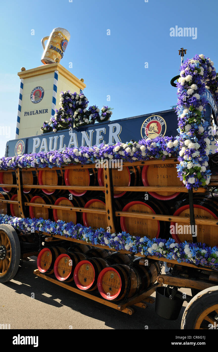 Wood barrels from the Paulaner Brewery on a horse-drawn cart in front of the Paulaner beer tower, Oktoberfest 2010, Munich Stock Photo