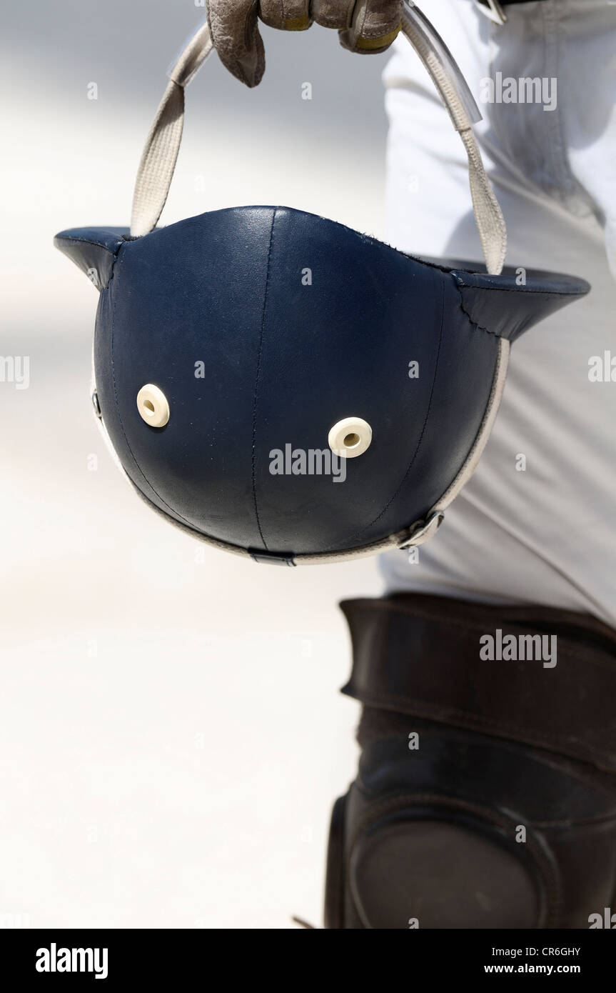 Polo player carrying his blue helmet on the strap, Airport Arena Polo Event 2010, Munich, Upper Bavaria, Bavaria Stock Photo