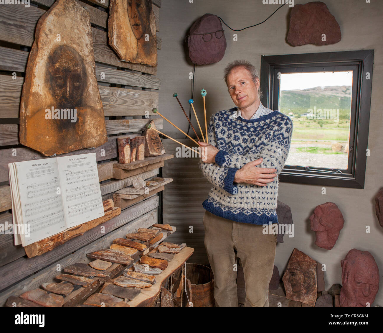 Stone Artist with handmade xylophone and other works, Borgarfjordur Iceland Stock Photo