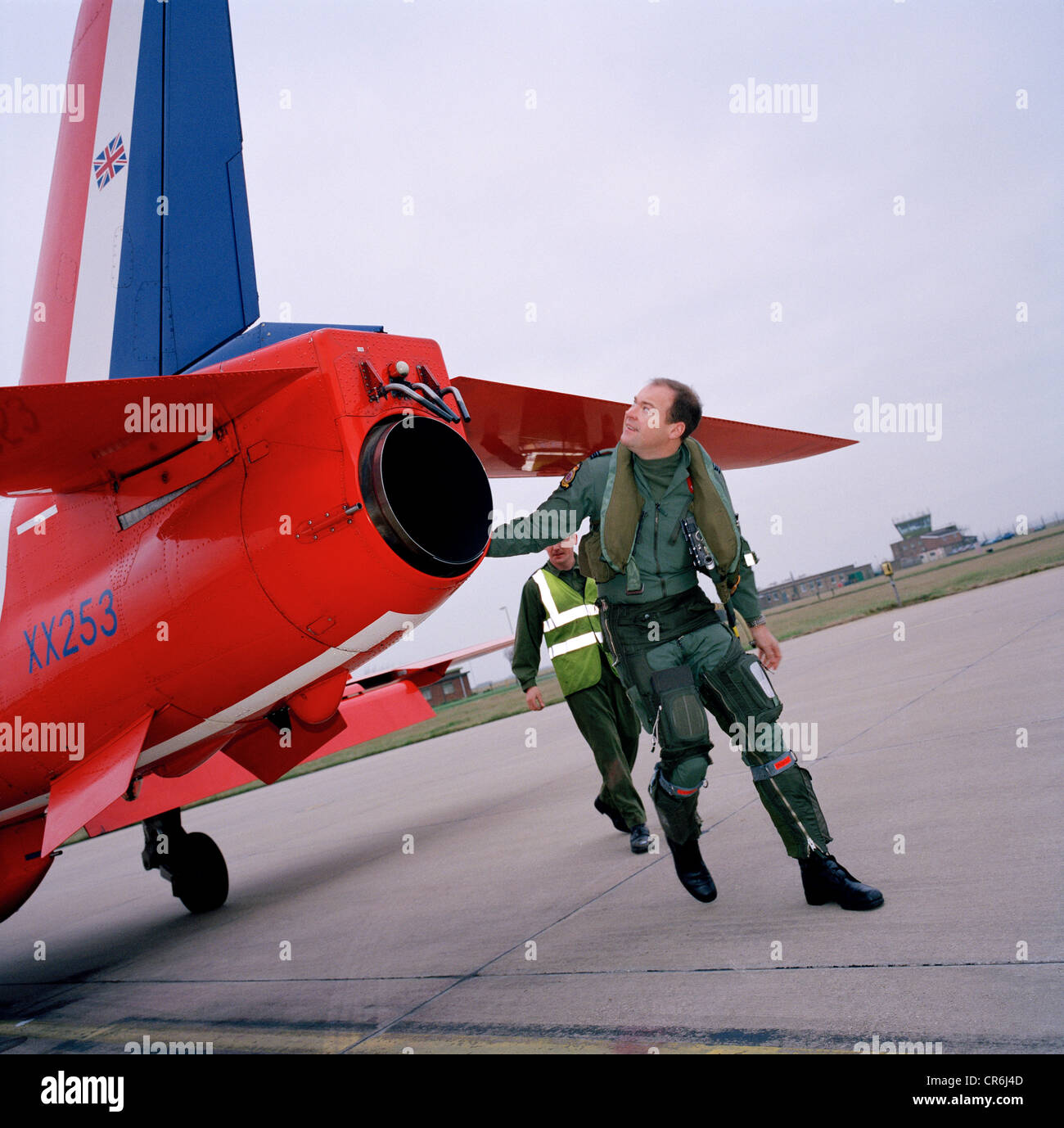 Pilot of the Red Arrows, Britain's RAF aerobatic team performs a pre-flight check before training flight. Stock Photo