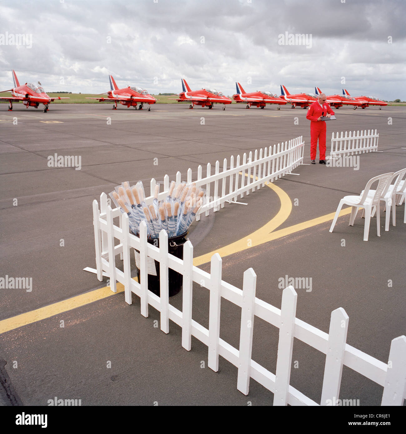 Ground commentator pilot of the Red Arrows, Britain's RAF aerobatic team readies himself before a public display. Stock Photo