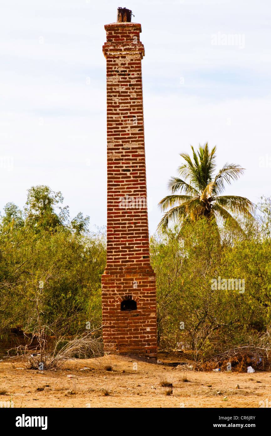 Brick chimney from destroyed building in 'Todos Santos' Baja Mexico Stock Photo