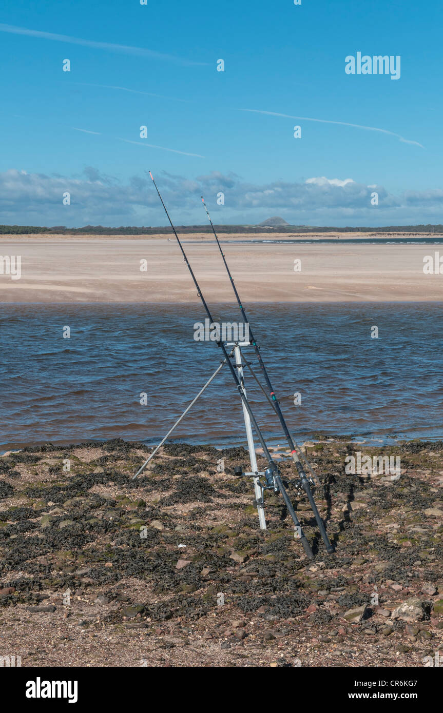 Fishing rods on the beach at Belhaven Bay West Barns nr Dunbar East Lothian Scotland Stock Photo