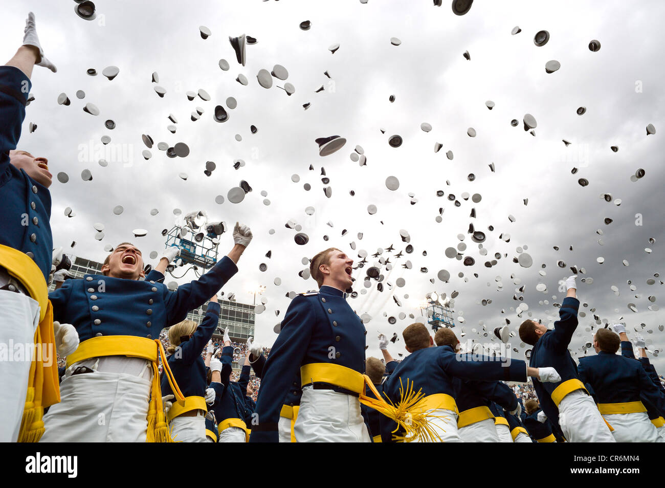 Newly commissioned second lieutenants throw their hats in the air during the commencement ceremony at the United States Air Force Academy May 23, 2012 in Colorado Springs, CO. Stock Photo