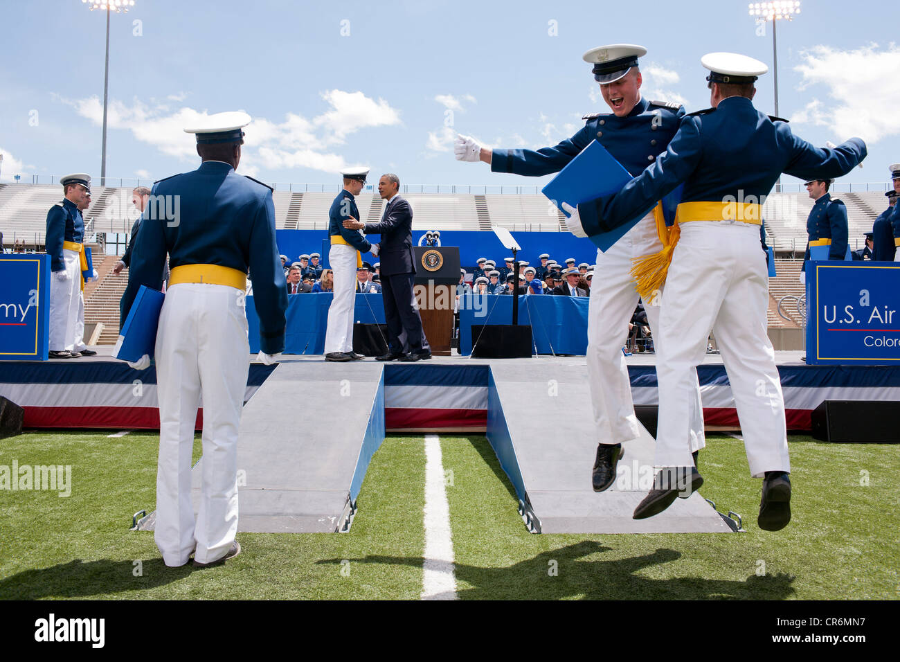 US President Barack Obama congratulates cadets as they receive their diplomas during the commencement ceremony at the United States Air Force Academy May 23, 2012 in Colorado Springs, CO. Stock Photo