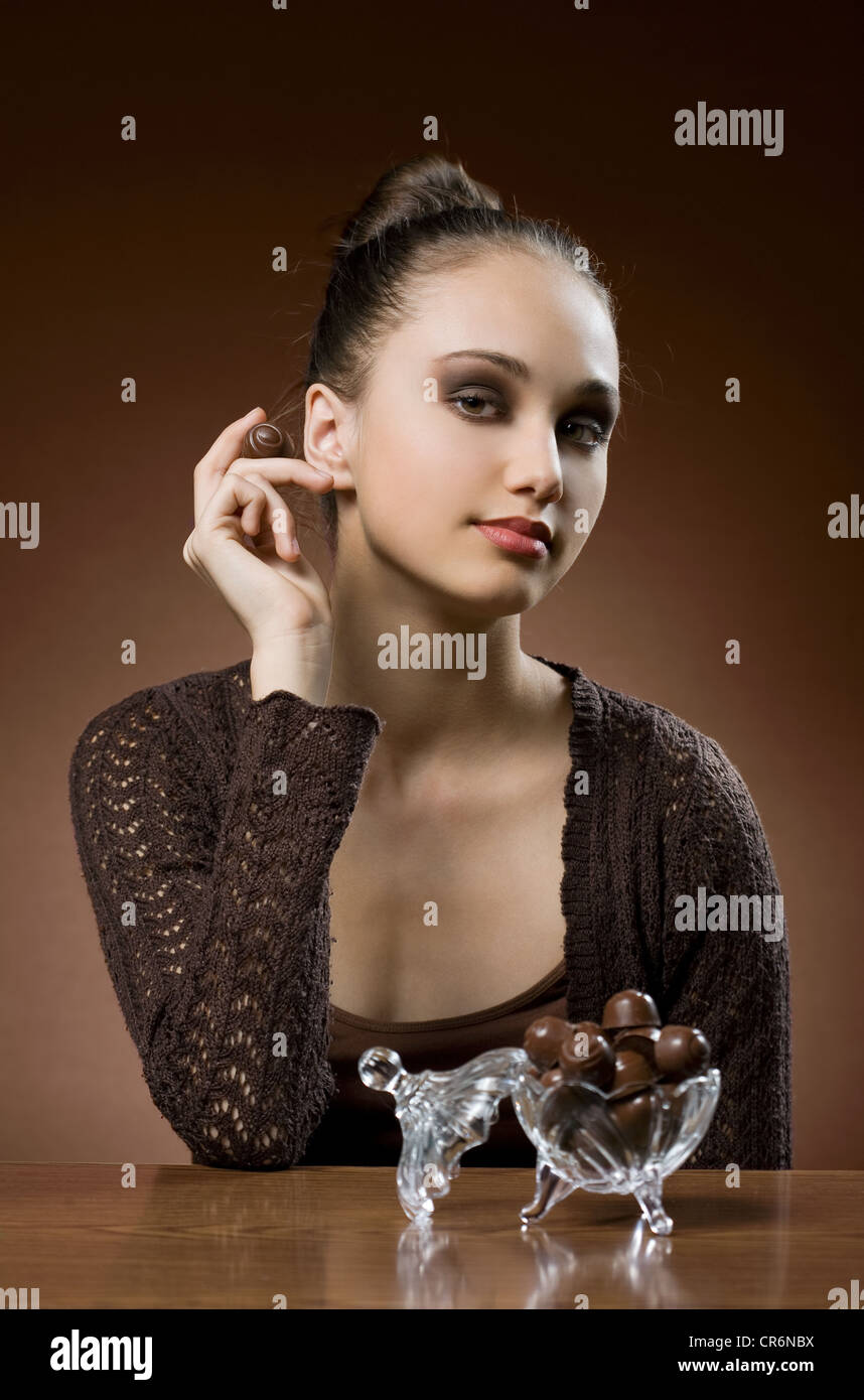 Chocolate heaven, young with dessert Stock Photo Alamy
