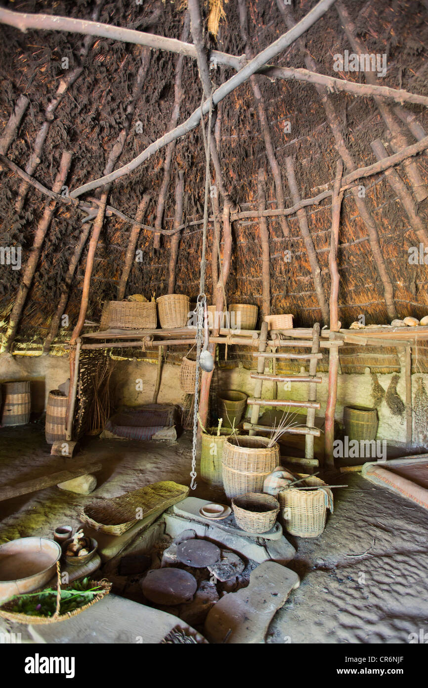 Representation of Interior of Roundhouse with kitchen utensils at Castell Henllys Iron Age hillfort , Pembrokeshire Wales UK 120095 Castell Henlys Stock Photo