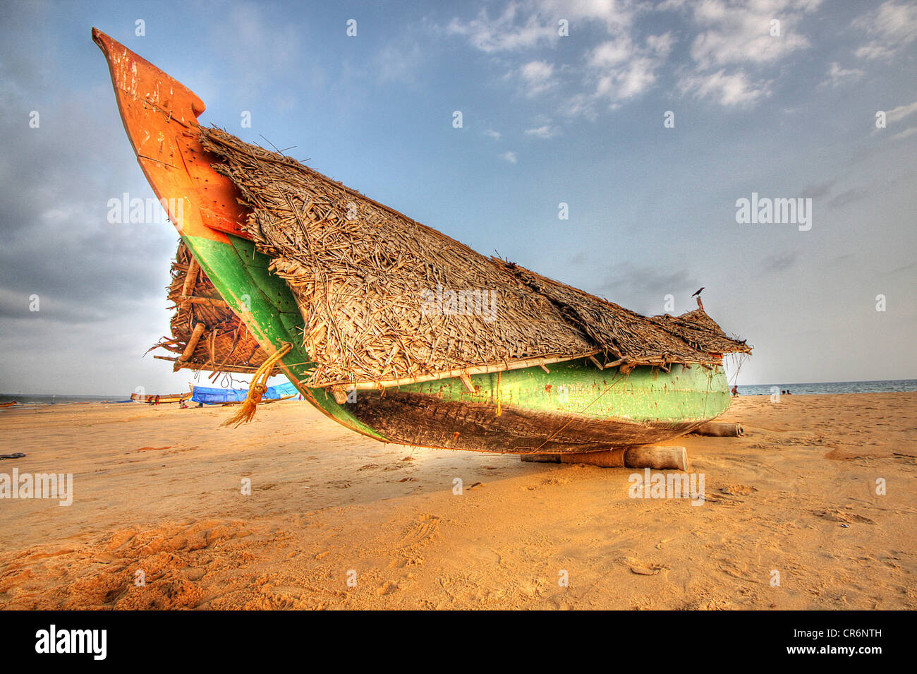 Kerala fishing boat on Kovalam beach, Kerala, India Stock Photo