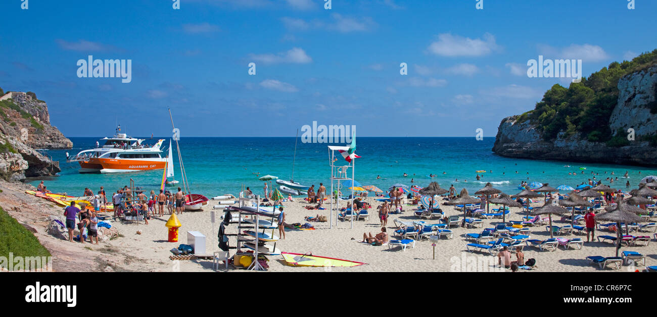 Excursion Boat Anchoring In The Bay Beach Of Cala Romantica - 