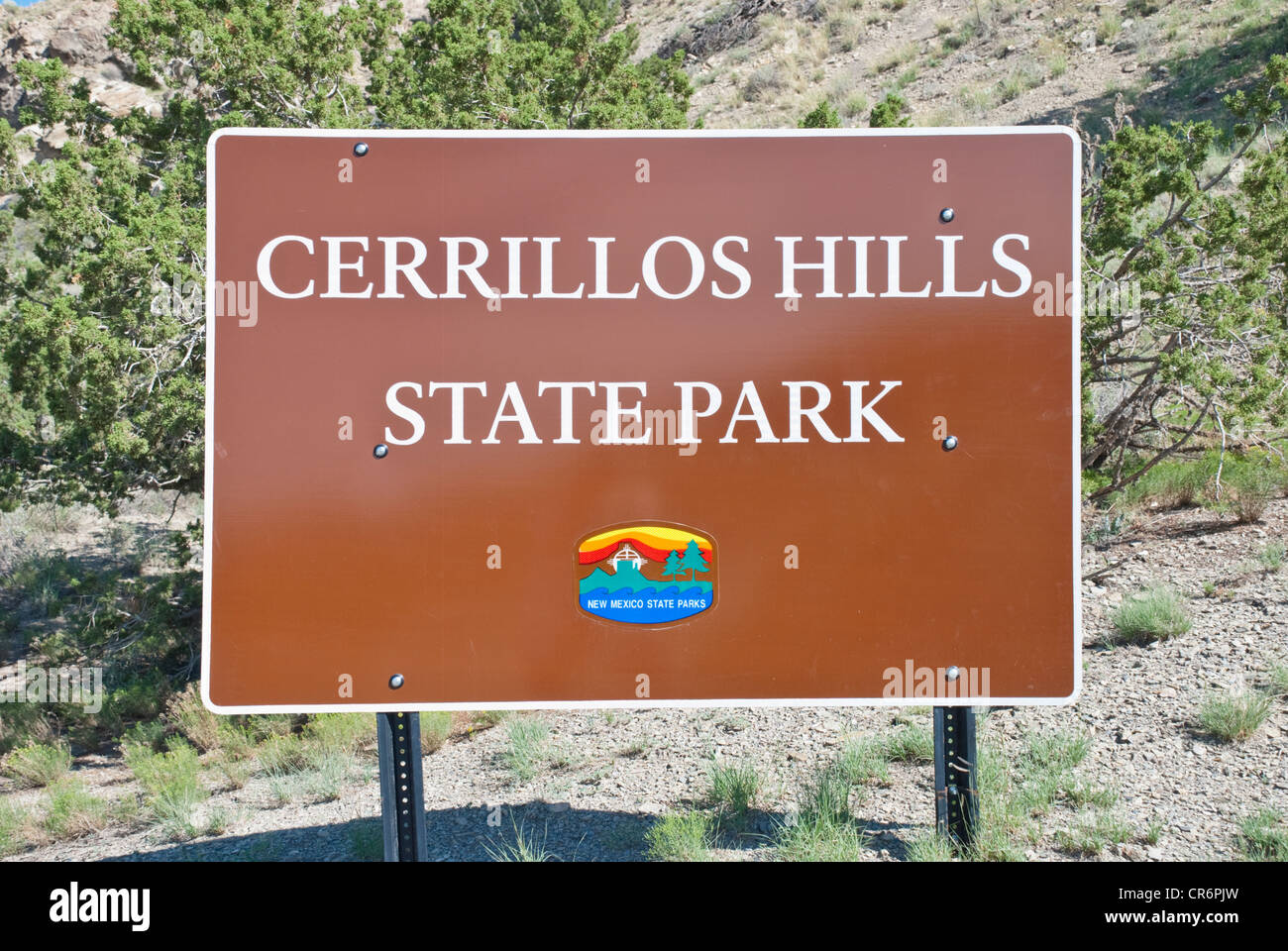 A large sign announces the entrance to Cerrillos Hills State Park. Stock Photo