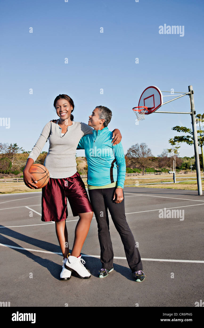 Mother and daughter playing basketball Stock Photo Alamy