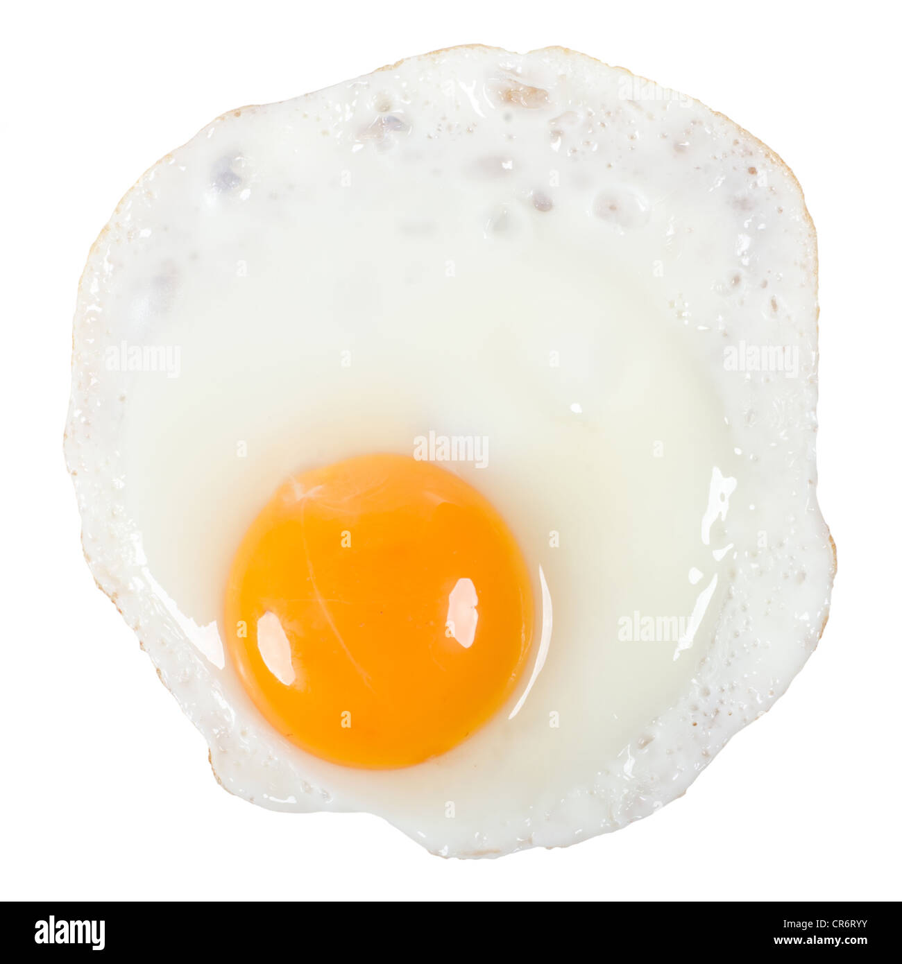 a fried egg isolated before white background Stock Photo - Alamy