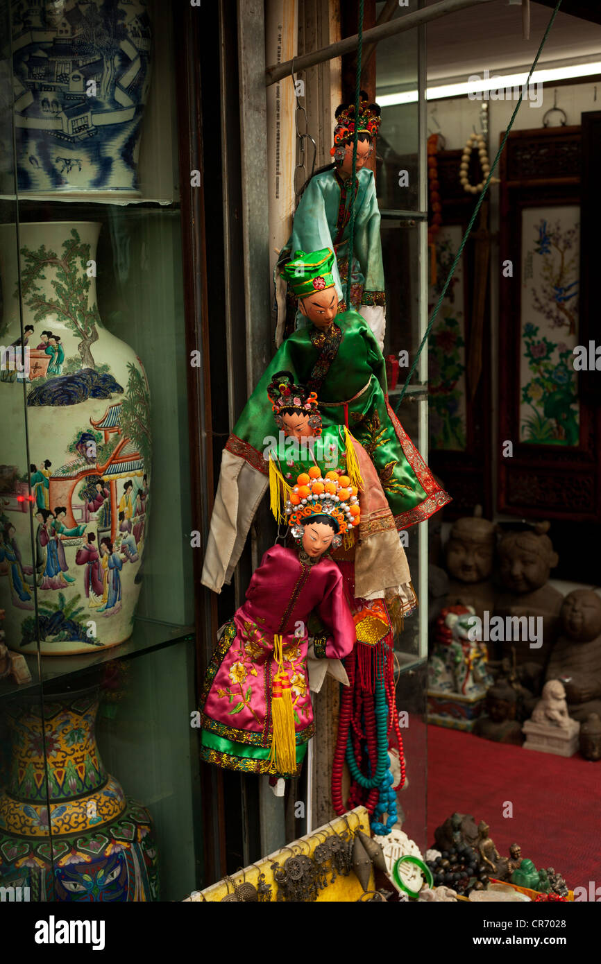 Traditional Chinese Puppets hanging outside street shop of China Shanghai Stock Photo