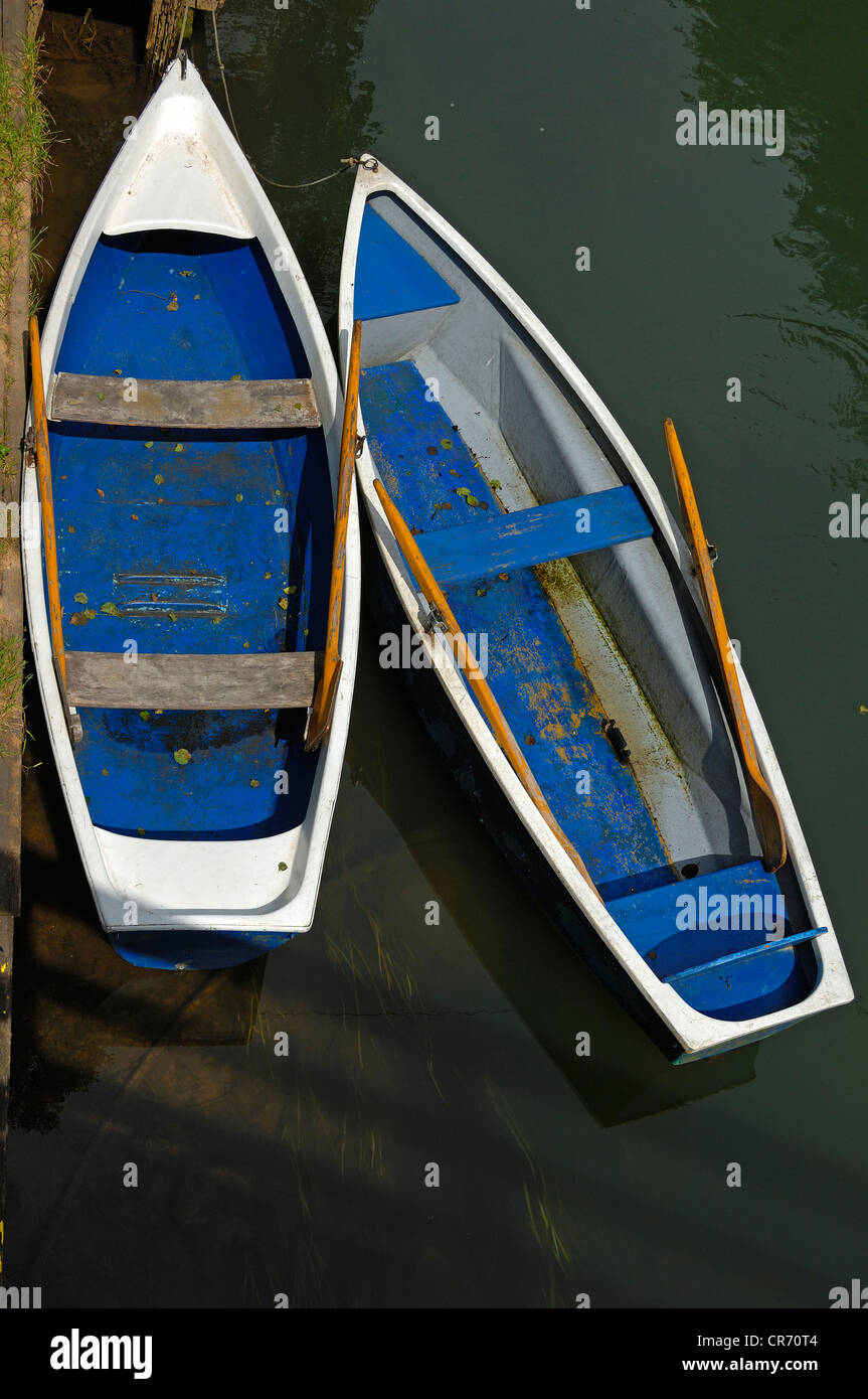 Two rowing boats at the jetty of a boat rental company