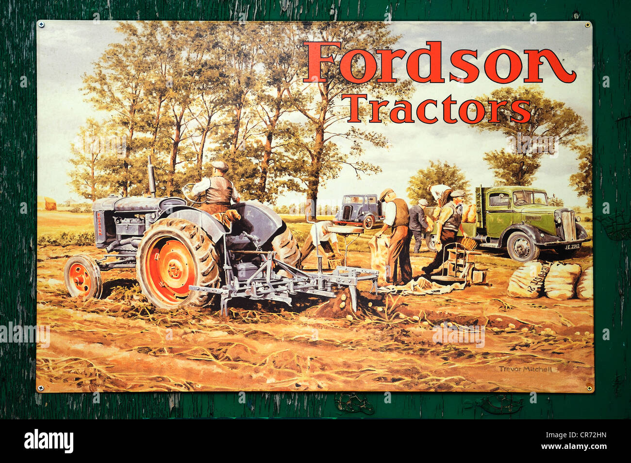 Old English advertising sign for tractors from the 1930s on a wooden wall at the port of Exeter, Devon, England, United Kingdom Stock Photo