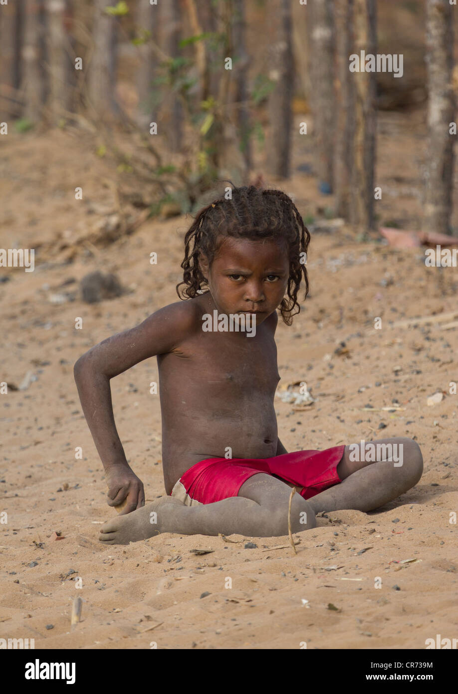 girl playing in sand, Ifaty village, Madagascar Stock Photo