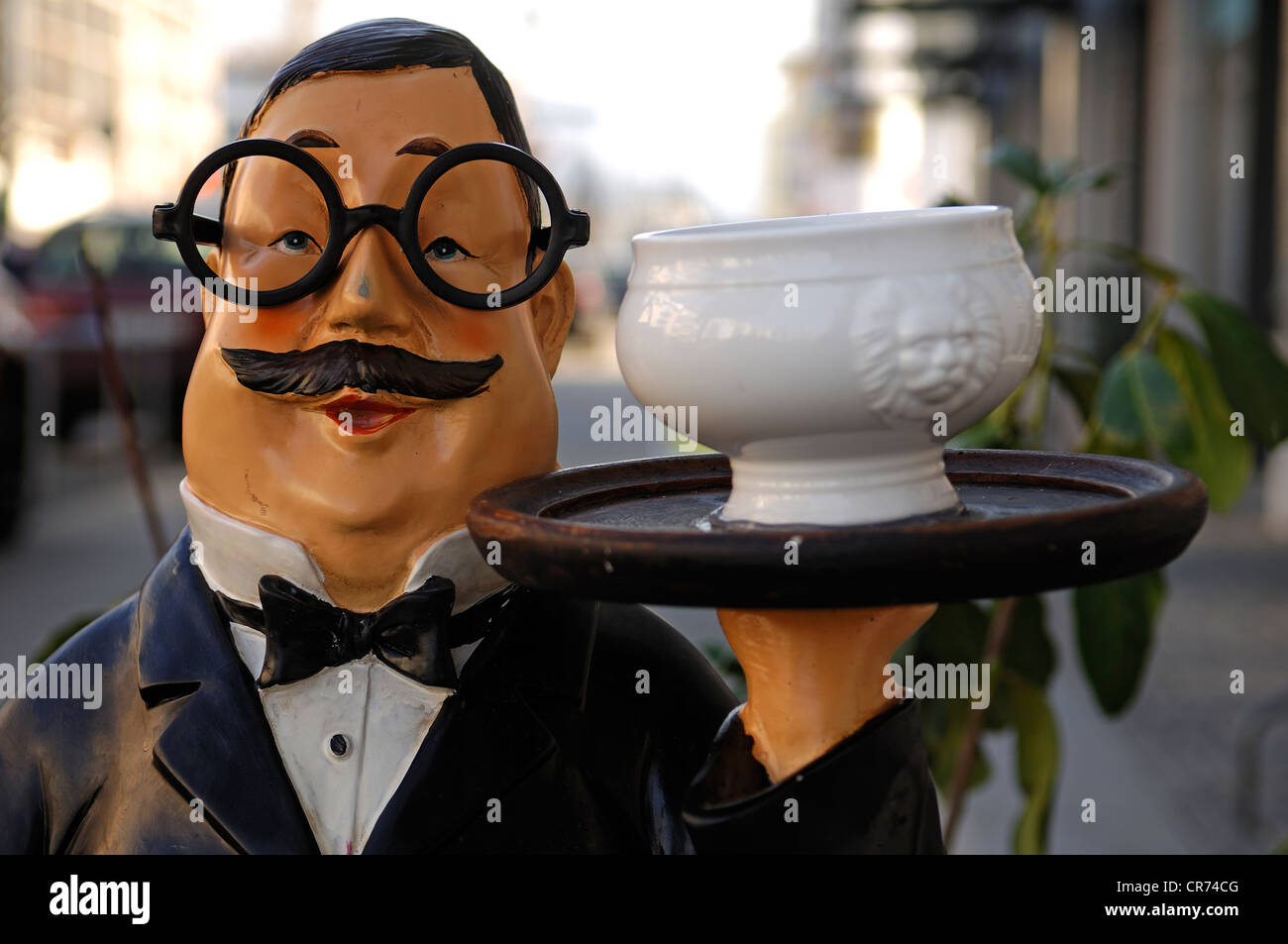 Butler figure carrying a soup bowl on a tray in front of a café, Freiburg, Baden-Wuerttemberg, Germany, Europe Stock Photo