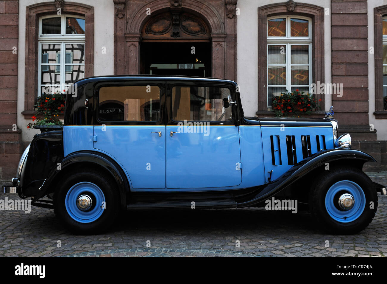 Light blue and black vintage Citroen C6 type 1934/35 in front of Town Hall, Ribeauvillé, Alsace, France, Europe Stock Photo